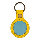 Etui pour airtag jaune et bleu